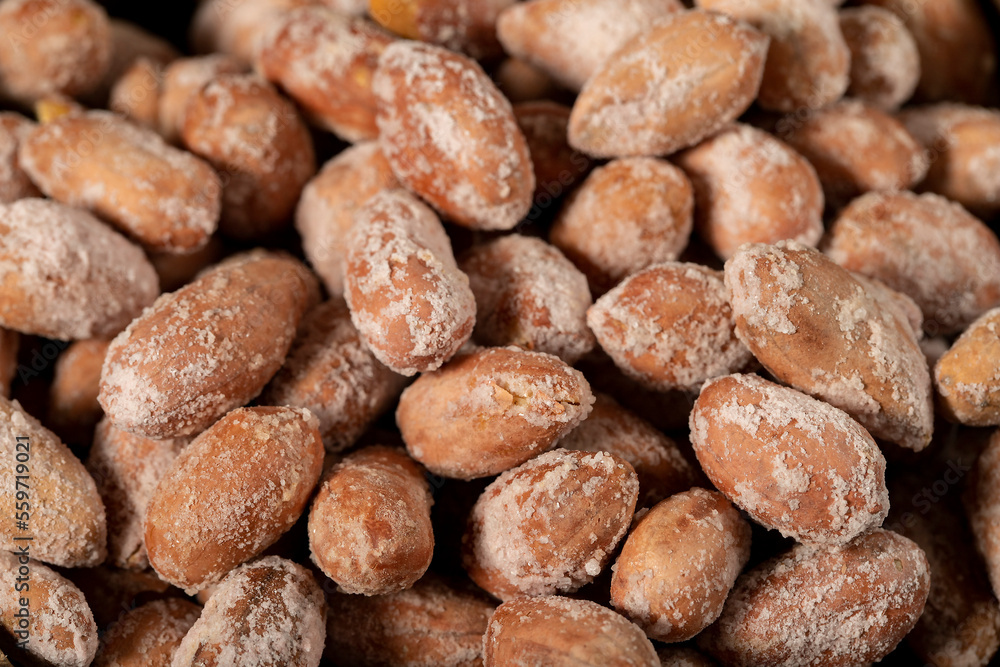 Salted peanuts on dark background. Pile of peanuts. Studio shoot. close up Salted peanuts on dark background. Pile of peanuts. Studio shoot. close up