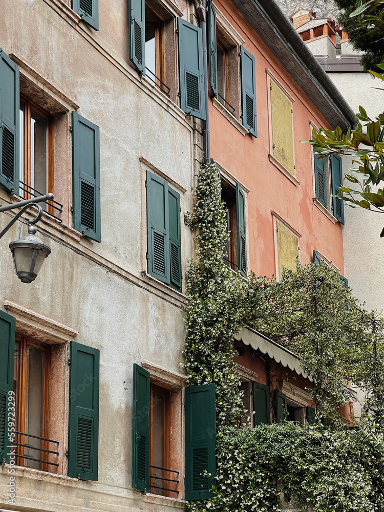 Naklejka premium Old historic architecture in Italy. Traditional European old town buildings. Aesthetic summer travel concept. Sunlight shadows