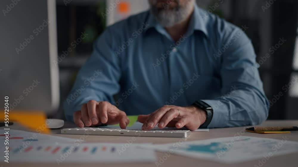 Close up view of the unknown caucasian man answering emails, typing keyboard Close up view of the unknown caucasian man answering emails, typing keyboard