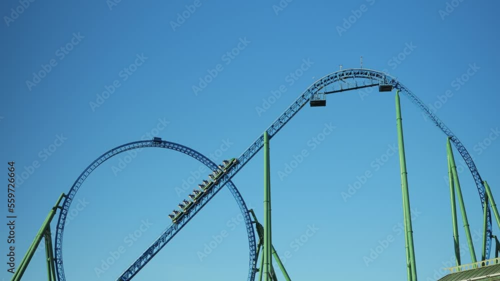 The trailers climb to the highest point of the roller coaster for the start of the trip. A hard way up for a quick start. High quality 4k footage The trailers climb to the highest point of the roller coaster for the start of the trip. A hard way up for a quick start. High quality 4k footage