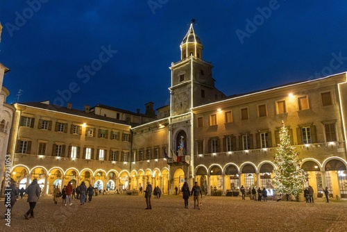 historic center of modena lit up at christmas with shop windows and shops decorated for christmas shopping photo