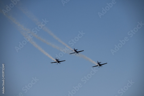 aerobatics on sports planes over the sea in the sky of Jordan