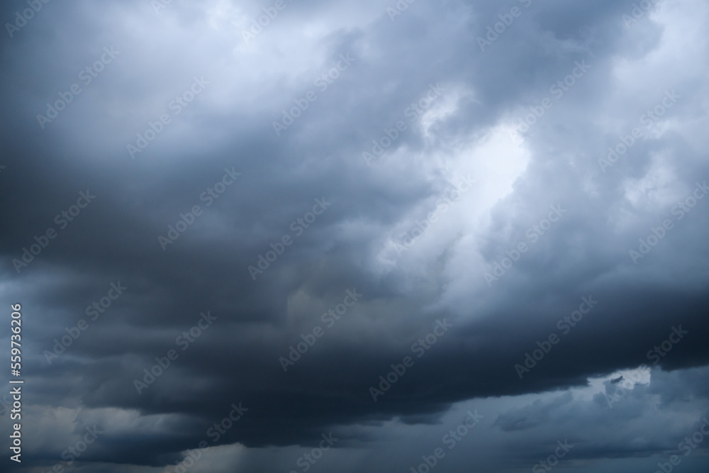 Storm clouds floating in a rainy day with natural light. Cloudscape scenery, overcast weather above blue sky. White and grey clouds scenic nature environment background Storm clouds floating in a rainy day with natural light. Cloudscape scenery, overcast weather above blue sky. White and grey clouds scenic nature environment background