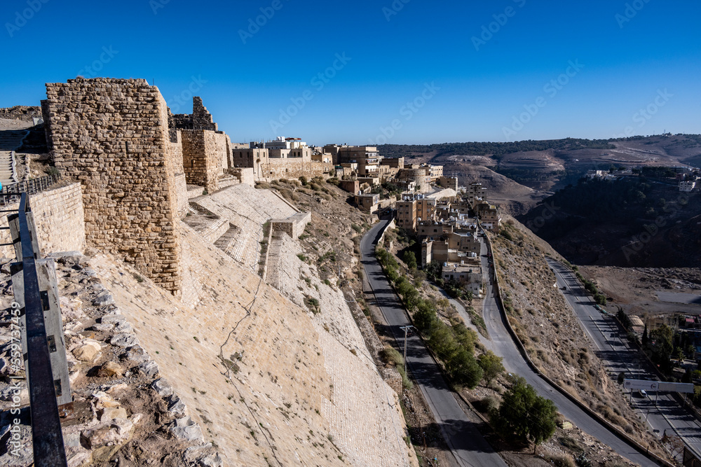 picturesque ancient ruins of Al-Karak fortress in Jordan on a sunny day against the blue sky