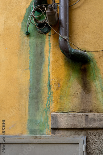 Old wall with stains and downpipe photo