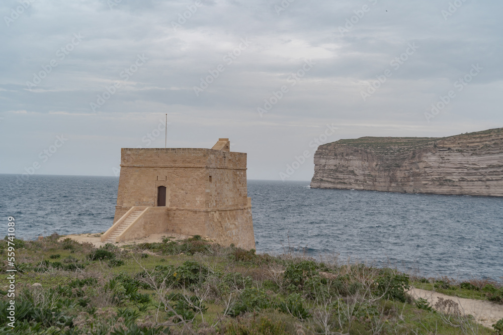 Cliffs at Xlendi in Gozo. With views over the sea. 