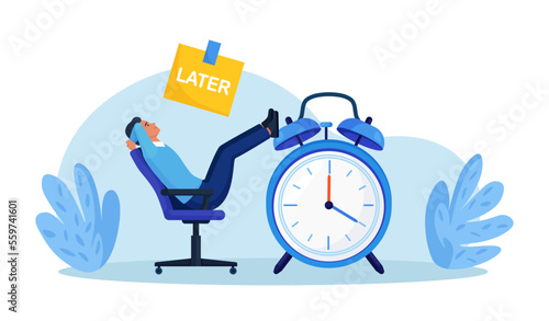 Procrastinating lazy businessman sitting in office with his legs up on alarm watch. Big sticky note with the word later on alarm clock. Procrastination and laziness, unproductive employee. Break time