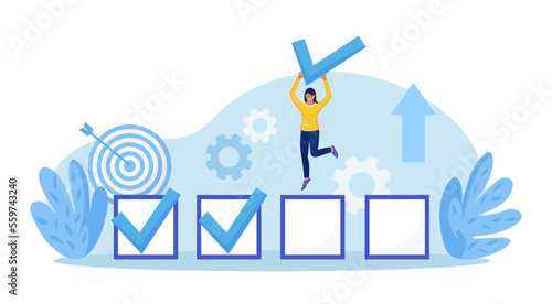 Happy employee woman celebrating completed task with check mark in hand. Goals accomplished. Achieving personal, business goal. Plan fulfilled, mission finished. Successful execution of business tasks