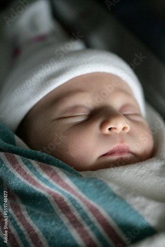 A sleeping newborn baby girl less than one day-old. photo