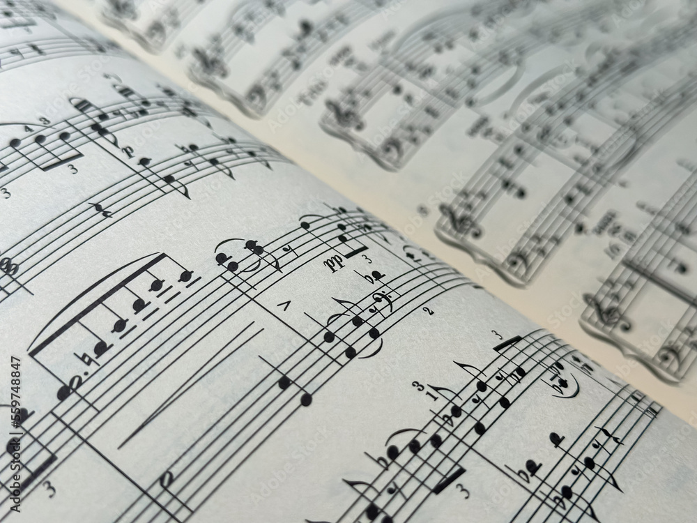 Closeup of Sheet Music. Musical Notes with Selective Focus. close up of a musical pentagram on a music sheet. Closeup of Sheet Music. Musical Notes with Selective Focus. close up of a musical pentagram on a music sheet.