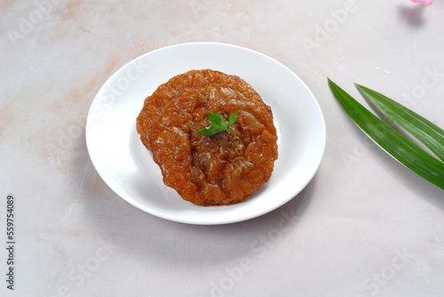 Kue Kucur or Kucur or kuih cucur, and called khanom fak bua or khanom jujun in Thai, is a traditional snack in Southeast Asia, including Indonesia, Malaysia and Southern Thailand. photo