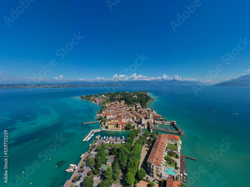 Panoramic views of the city of Sirmione located on the shores of lake Garda. Rocca Scaligera Castle in Sirmione. View by Drone.