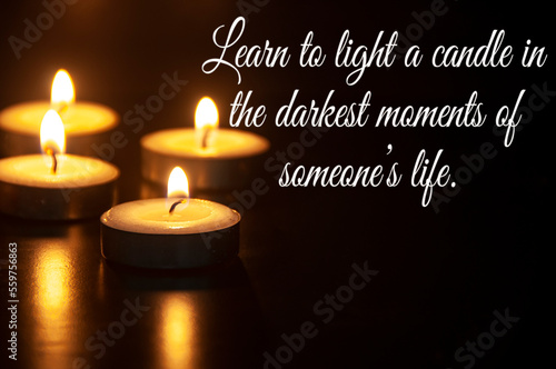 Learn to light a candle in the darkest moment of someone's life quote with candle light background. Motivational concept.