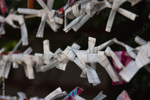 A fortune telling slip at Tomioka Shrine closeup photo