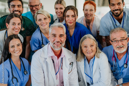 Portrait of happy doctors, nurses and other medical staff in hospital. photo