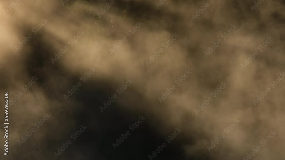 Hot springs and fog in Thailand with morning sunlight. Morning atmosphere at Chae Son National Park, Natural Hot Spring, Lampang Province, Thailand. Hot springs and fog in Thailand with morning sunlight. Morning atmosphere at Chae Son National Park, Natural Hot Spring, Lampang Province, Thailand.