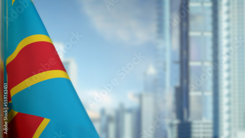 flag of Democratic Republic of Congo on modern city architecture bokeh background for state holiday - abstract 3D illustration