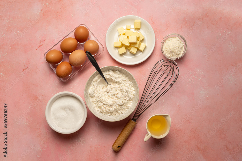 Food ingredients for baking eggs, flour, butter, oil and milk. Top view