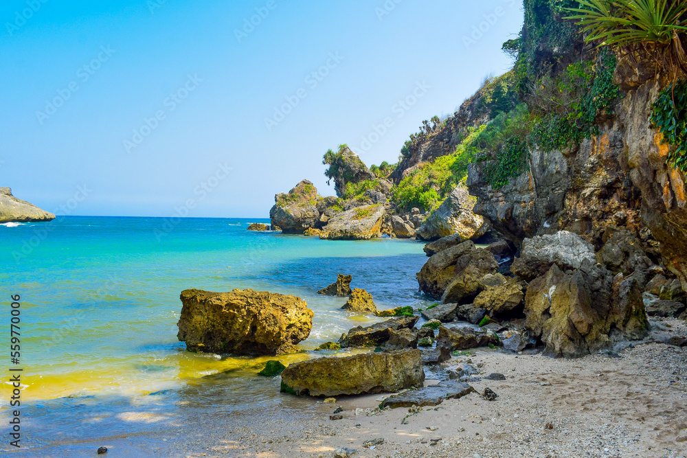 The beauty of white sand beach with beautiful scenery and rocks around it. The beauty of white sand beach with beautiful scenery and rocks around it.