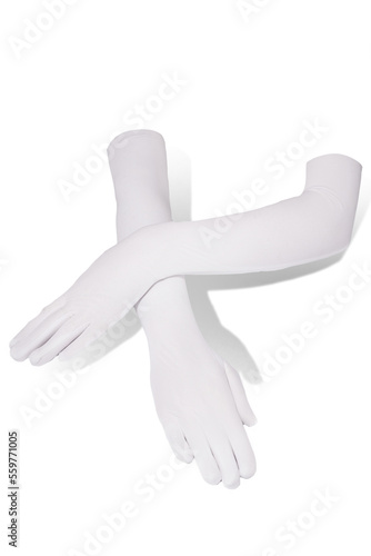 Subject shot of crossed female hands in the elegant white evening elbow gloves made of the soft translucent fabric. The photo is made on the white background.