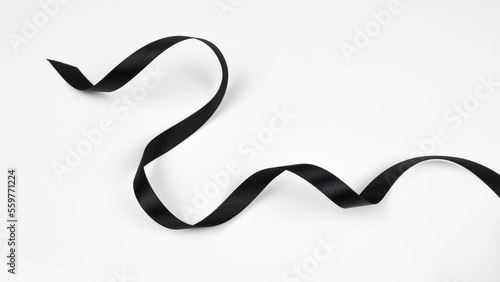 Abstract shape black ribbon isolated on white background.