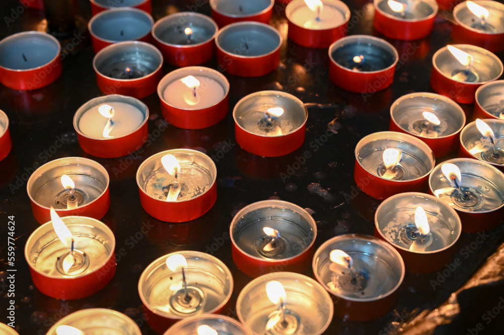 Burning candles my alter in church altar. Prayer candles in Catholic church. Burning candles my alter in church altar. Prayer candles in Catholic church.