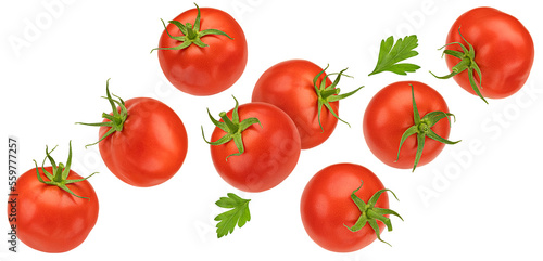 Falling cherry tomatoes isolated on white background