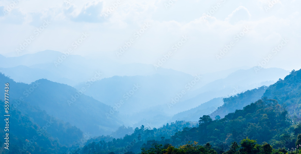 Mountain in fog, mountain ridge and valley with morning sky landscape.