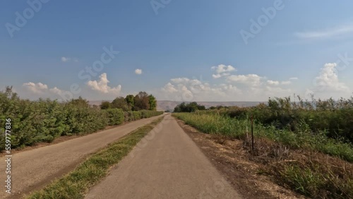 Walking on a dirt path in the Agmon Hula nature reserve in northern Israel photo