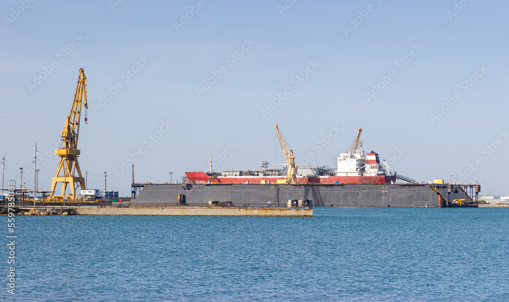 Cargo ship in a shipyard at anchor for repairs.Shipbuilding industry