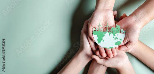 Hands together holding ESG Environmental, environmental, social, and governance in sustainable and ethical business on the Network connection. photo