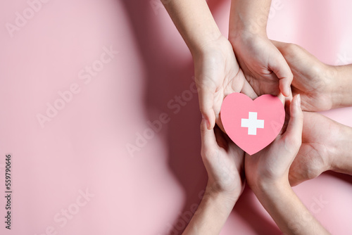 Obraz na płótnie hands holding blood drop paper cut, blood transfusion, world blood donor day, red cross to give blood