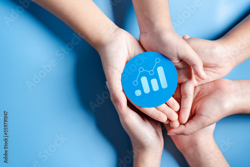 Hands holding chart growth with business target planning development leadership and customer target group, investment growth and success development, achievement, goal, strategy, finance concept.