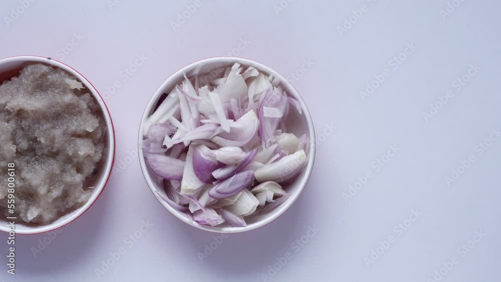 top view of slice of onion and paste in a bowl on white background top view of slice of onion and paste in a bowl on white background