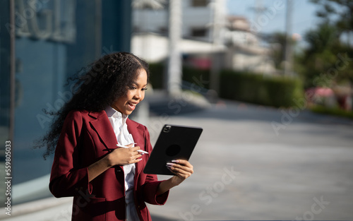 African american business woman with tablet pc in office district.