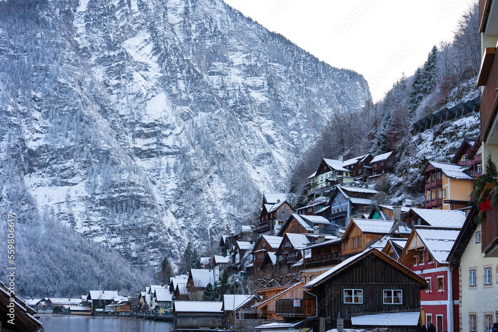 Fototapeta premium beautiful cityscape of the special city Hallstatt in Austria Salzkammergut snowy winter mountains and lake and wooden details