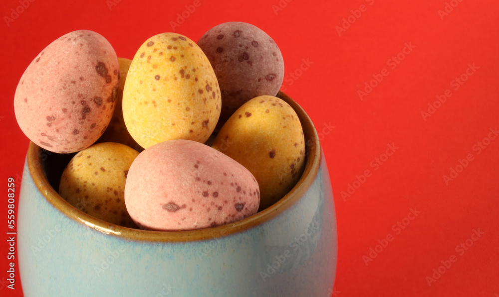 Chocolate easter eggs in an egg cup Chocolate easter eggs in an egg cup