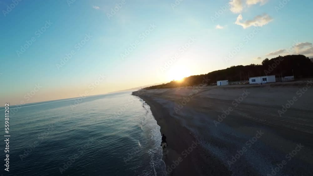 Ride a horse by the sea at sunset Ride a horse by the sea at sunset