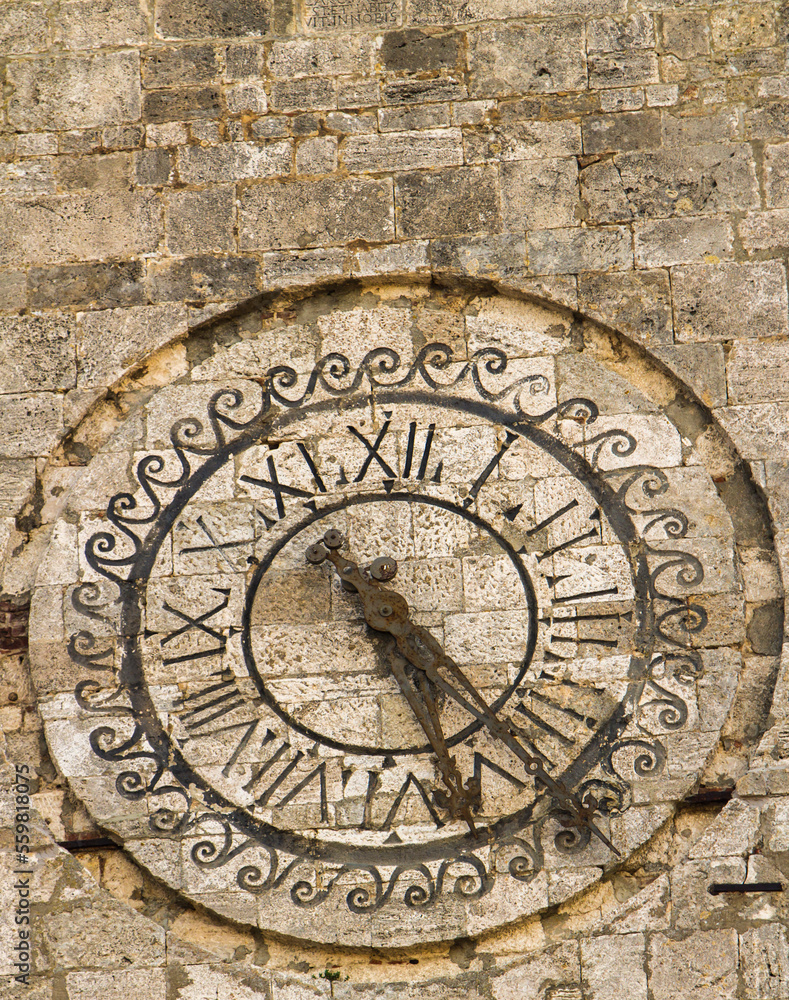 Clock at tower of the Town Hall of Montepulciano in Tuscany