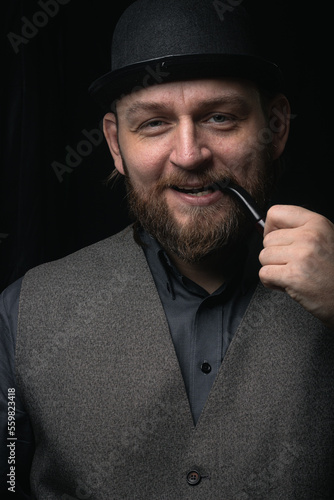 stylish man in retro outfit suit hat smoking wooden pipe sherlock holmes look cosplay england gentleman fashionable confident gangster Guy Ritchie Charlie Hunnam style photo