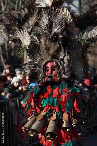 Sofia, Bulgaria - January 8, 2023: Masquerade festival "Surva" in Sofia, Bulgaria. People with mask called Kukeri dance and perform to scare the evil spirits.