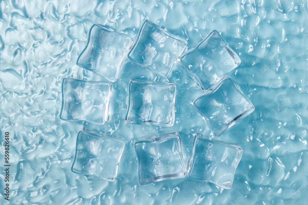 Ice cubes on the water on a blue background. Ice cubes on the water on a blue background.