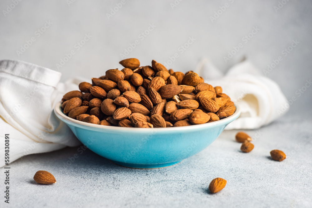 Ceramic bowl with organic almonds Ceramic bowl with organic almonds