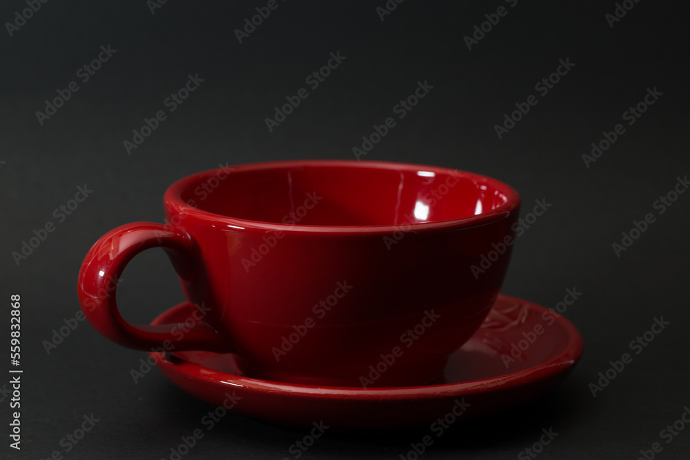 Red mug on a dark pleasant background Red mug on a dark pleasant background
