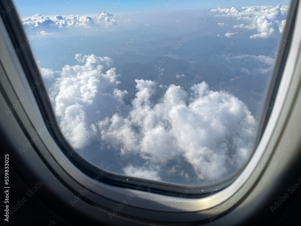 Airplane window , Cloud view. Travel concept. Airplane trip.
