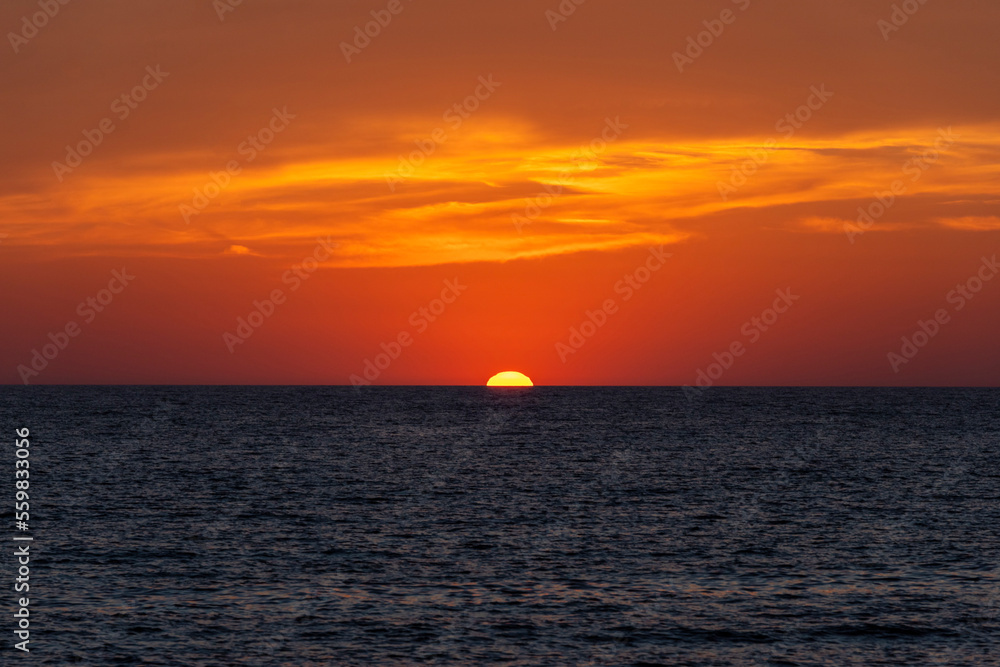 View of a beautiful sunset with red sky and clouds, Elba Island, Tuscany, Italy. View of a beautiful sunset with red sky and clouds, Elba Island, Tuscany, Italy.