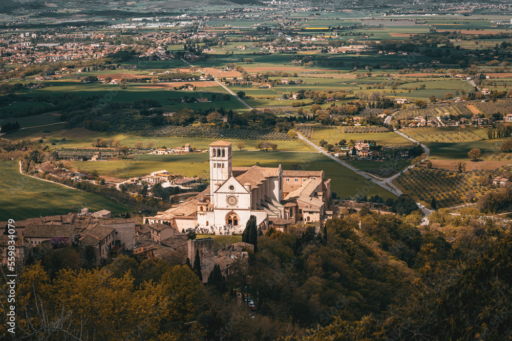 panorama view of san francesco basilica in assisi, italy, on a spring cloudy day