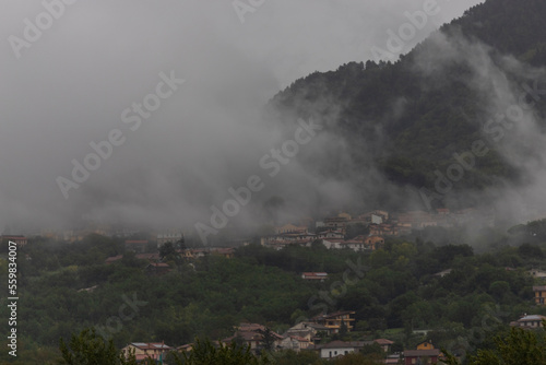 View of Santo Stefano del Sole on the hill with low clouds, Irpinia, Avellino, Campania, Italia.