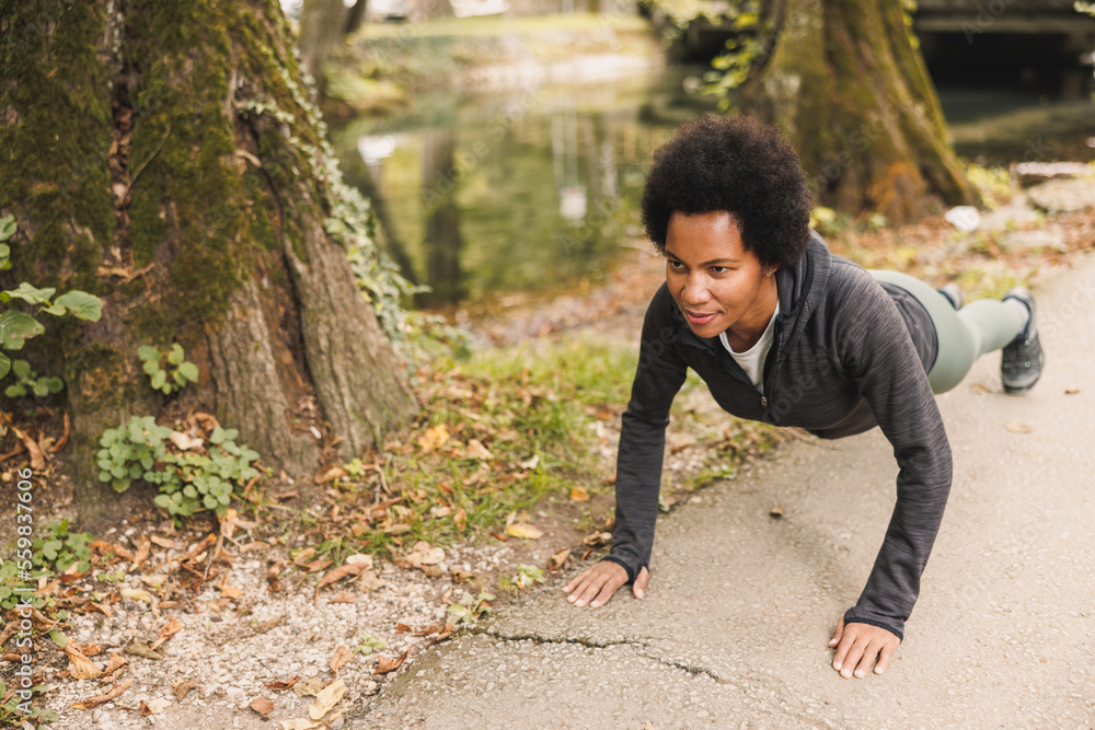 Black Woman Warming Up Before Running In Nature Black Woman Warming Up Before Running In Nature