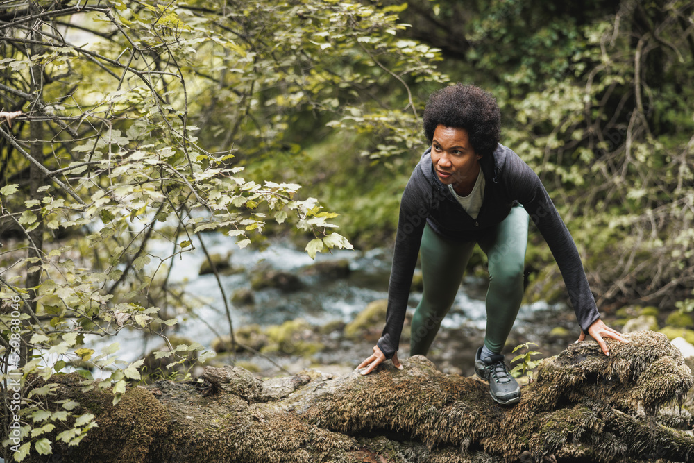 Black Woman Walks On Rocks At Mountain River Black Woman Walks On Rocks At Mountain River